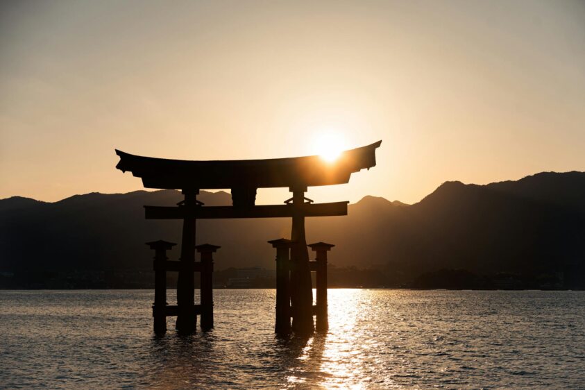 a silhouette of the itsukushima shrine in japan